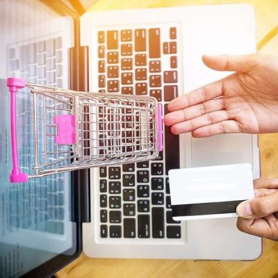 cropped-image-woman-inputting-card-information-key-phone-laptop-while-shopping-online_1423-76